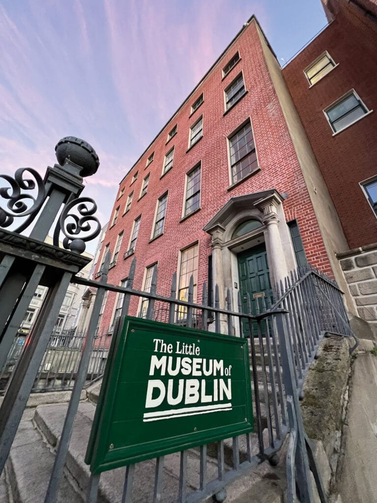 The exterior of the Little Museum of Dublin including a sign with the museum logo