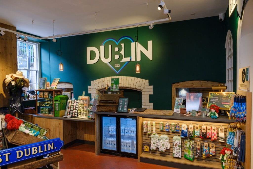 The museum shop featuring a large Dublin logo the wall and different shop products