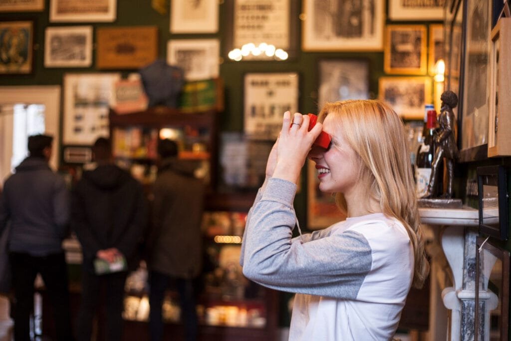 A guest looking through an old viewmaster in the Treasury in the Little Musem