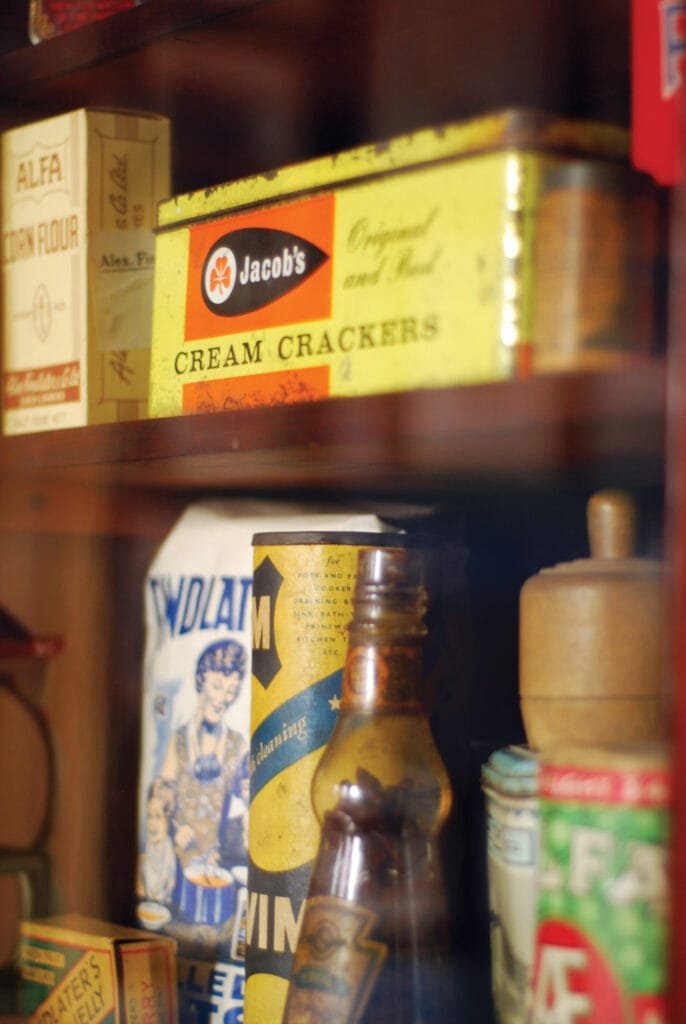 A display of some old groceries in the Treasury in the Little Museum, featuring an old tin of Jacobs Cream Crackers.