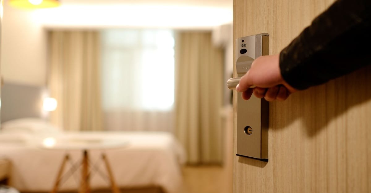 A soft-lit hotel room entrance, welcoming guests with luxury appeal and comfort.