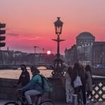 Sunset over the River Liffey from Grattan Bridge in Dublin, with the Four Courts dome at dusk