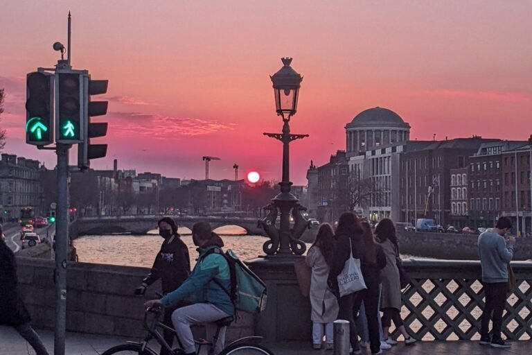 Sunset over the River Liffey from Grattan Bridge in Dublin, with the Four Courts dome at dusk