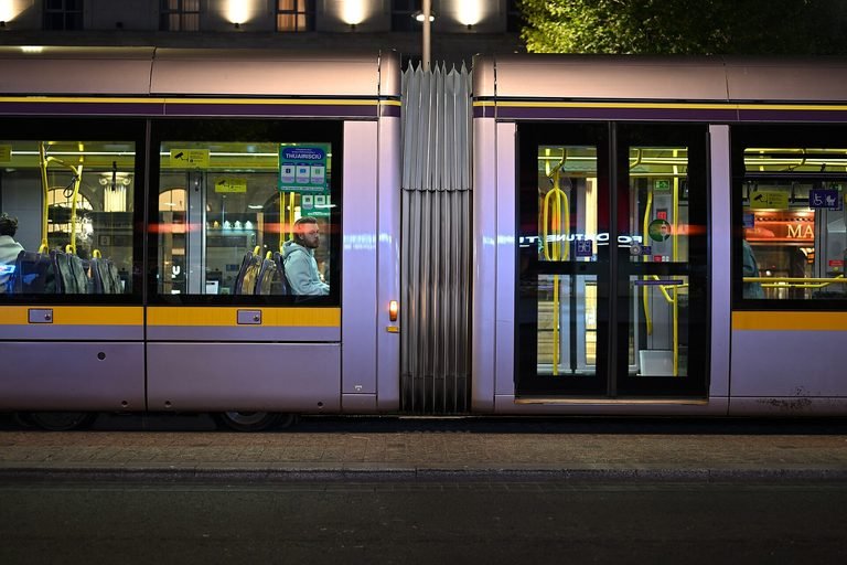 A Luas tram stopped at O'Connell Upper at night, a handy option for getting around Dublin