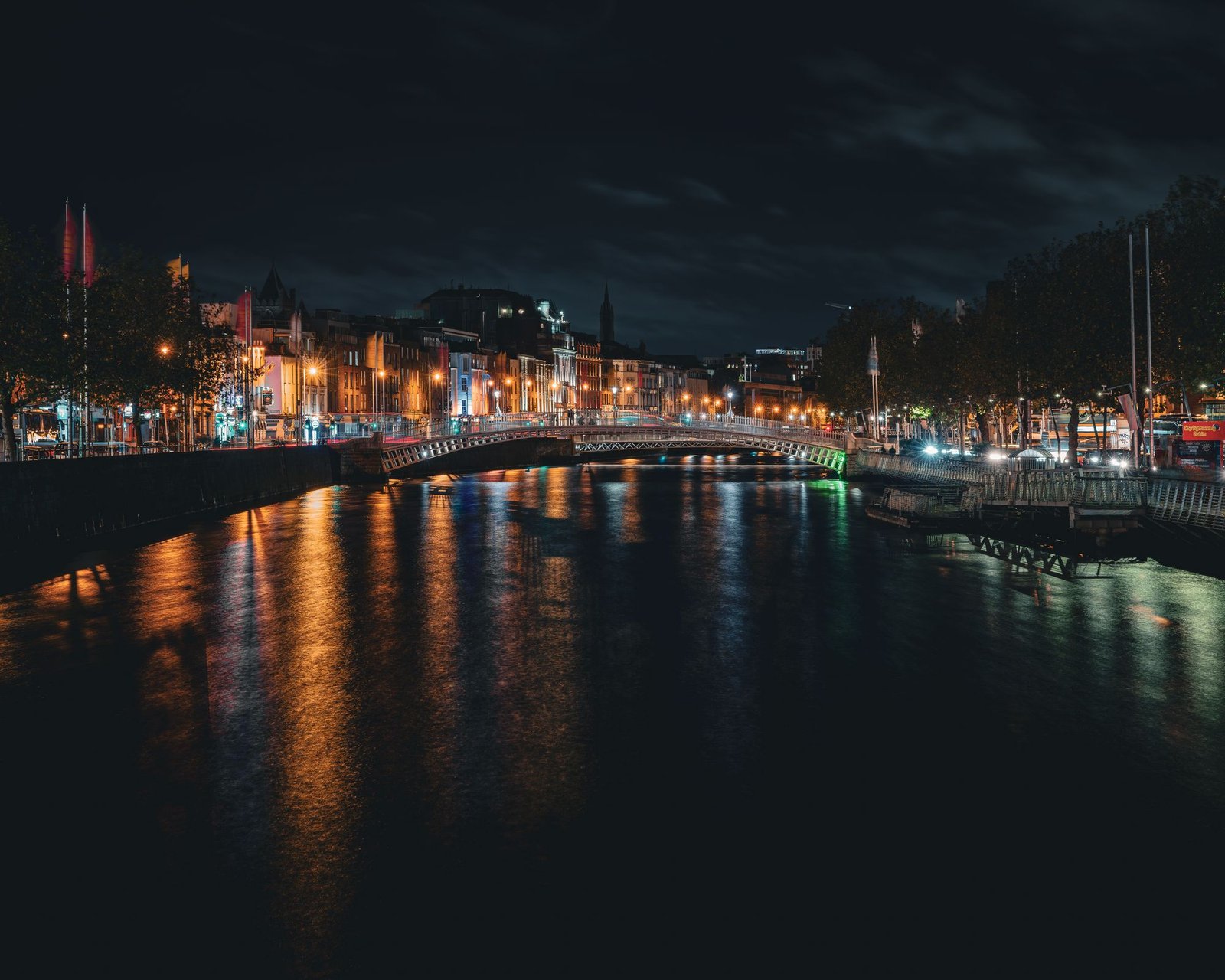 Ha'penny Bridge lit up at night over the River Liffey, the heart of New Year's Eve in Dublin